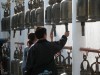 People ringing the bells for good luck at Doi Suthep, Chiang Mai